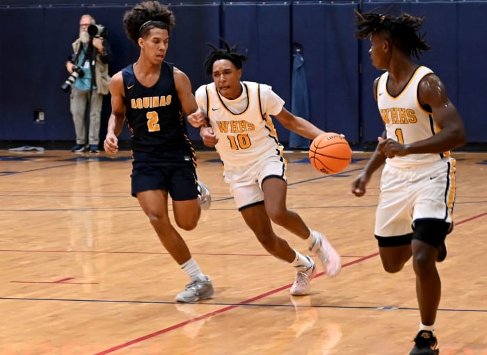 Winter Haven guard Eric Dailey drives the ball up floor against St. Thomas Aquinas on Saturday at the Kingdom in the Sun Tournament at Vanguard High School in Ocala.